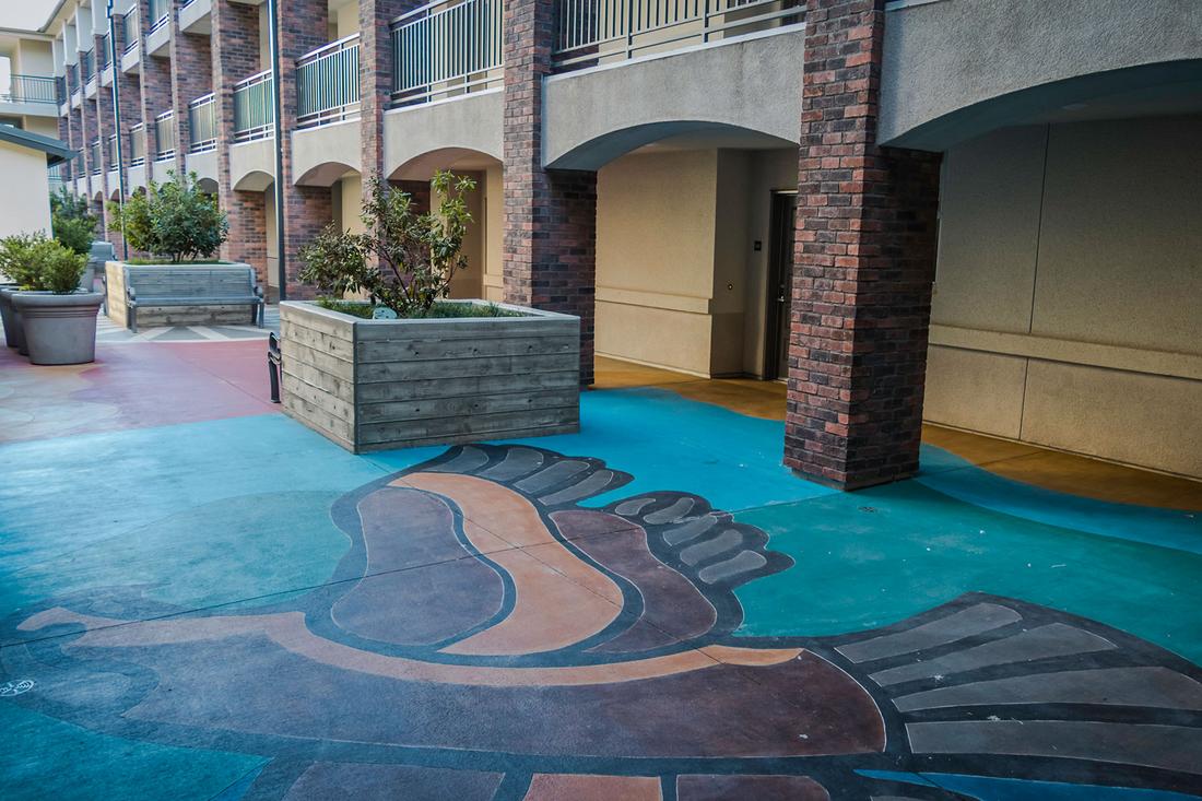 a building with a mural painted on the floor.
